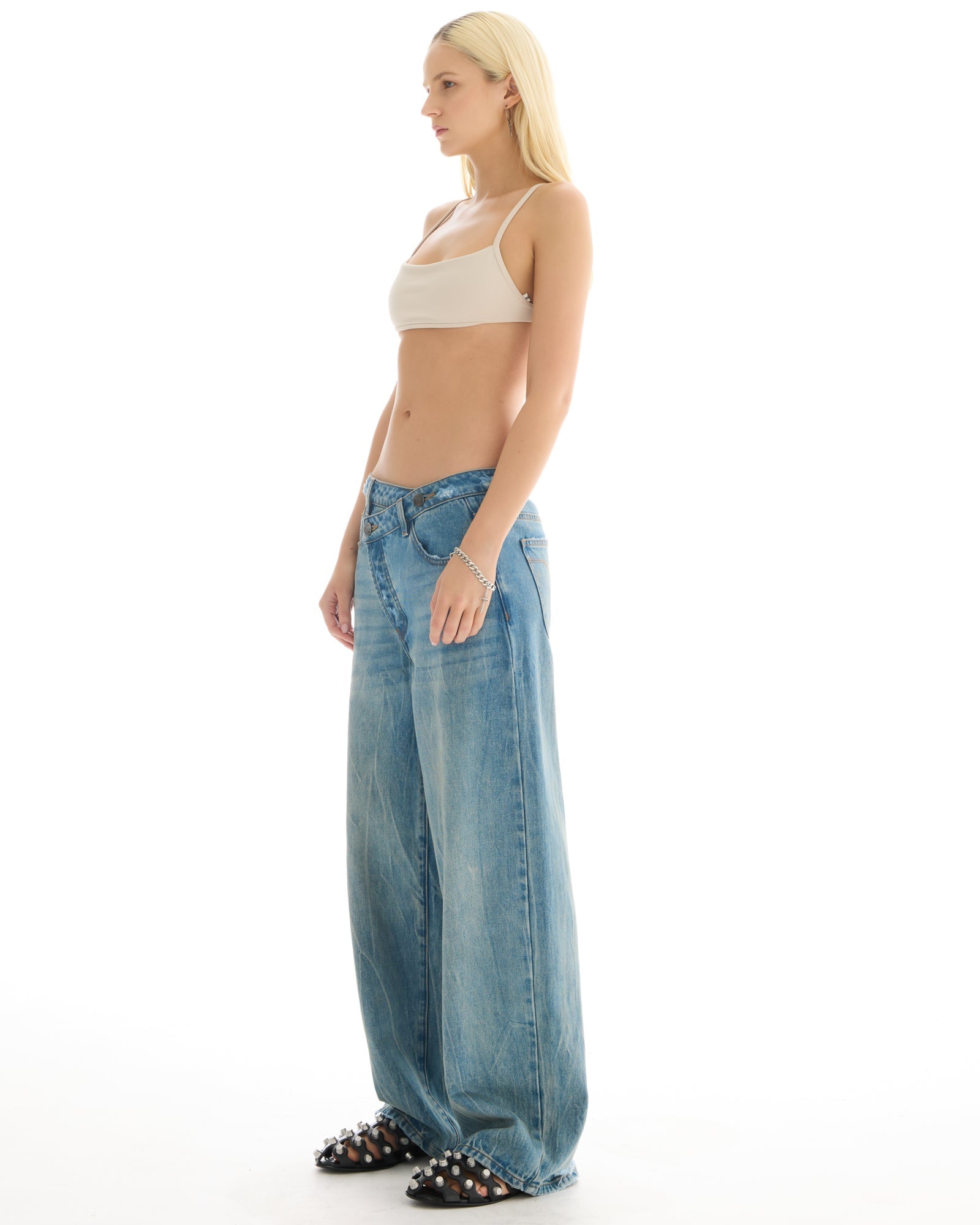 Cross Over Slouch Denim Jeans by THE TALES - close-up detail